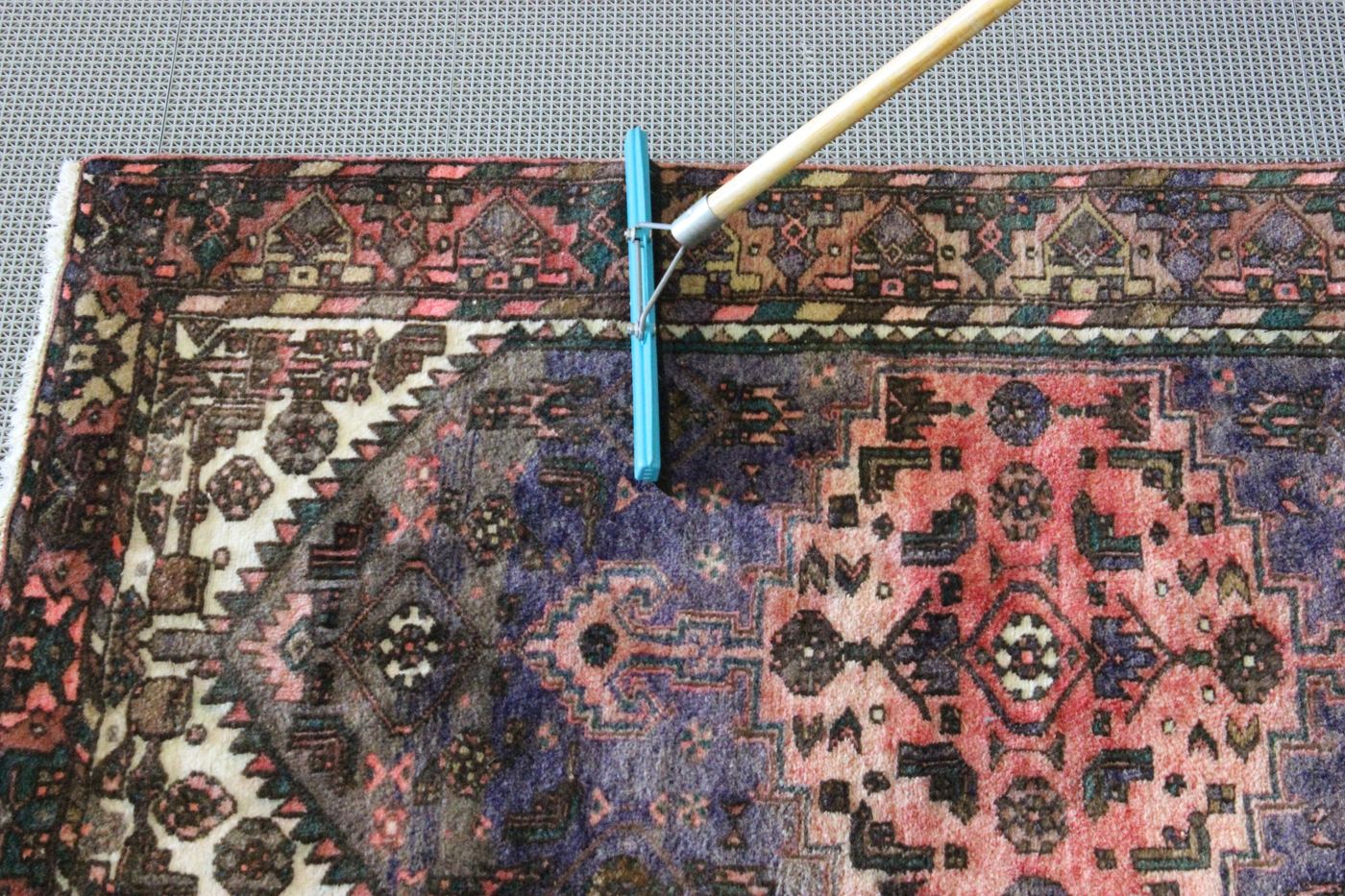 Persian rug being washed by hand at the Miami shop